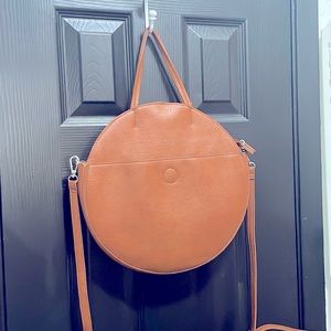 Round faux leather hand/crossbody purse